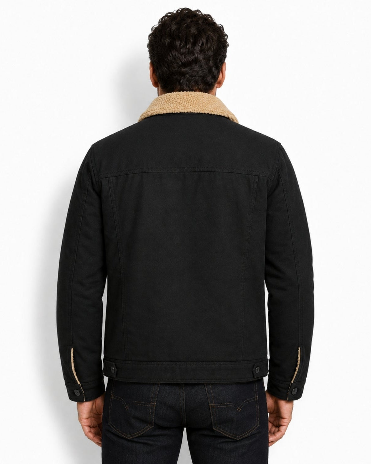 Back view of men's heavyweight winter canvas jacket in black, demonstrating the tailored, structured fit.